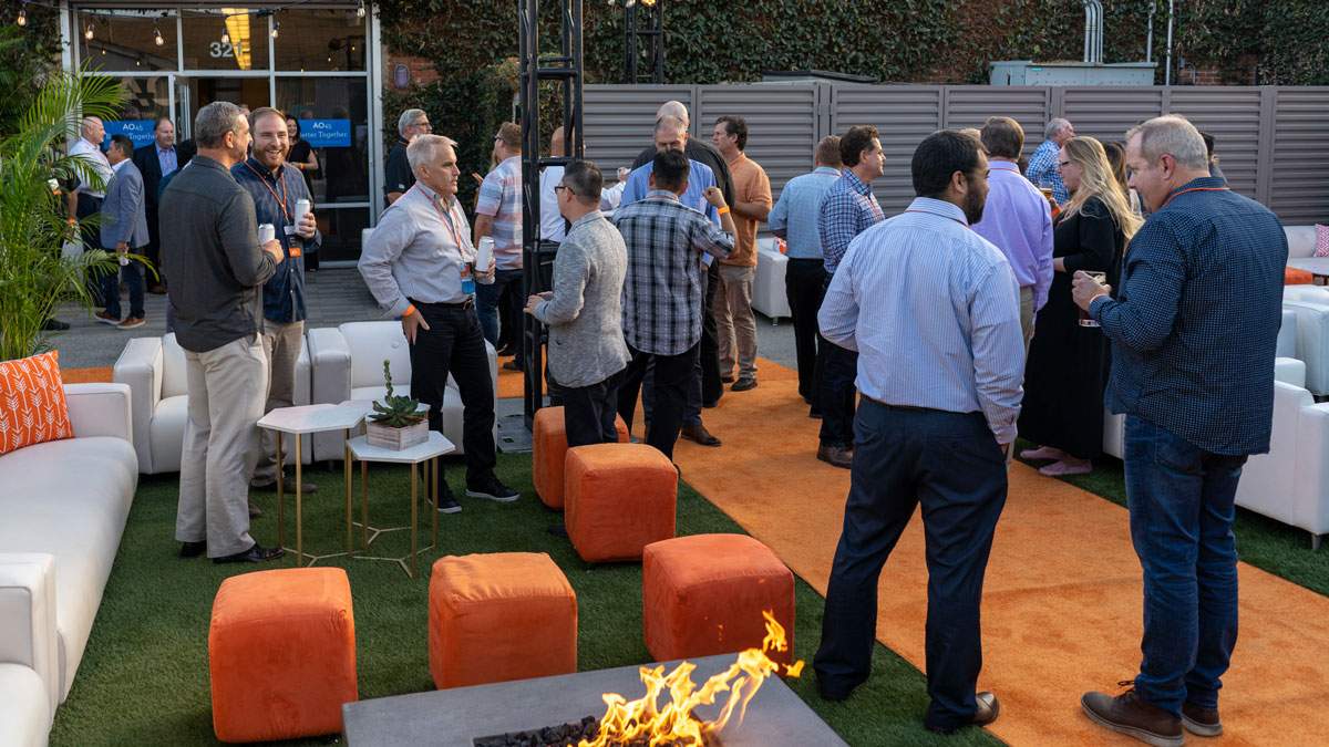 Employees and clients gather at an elegant open house event in Orange County, CA produced by James Event Productions.