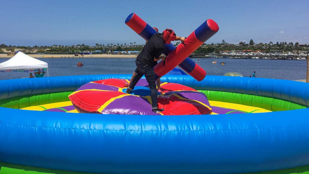 A fun one-on-one challenge, the inflatable Joust game is a great way to test your balance and skills against your opponent in a safe, colorful enclosure..