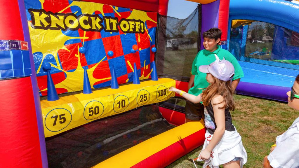 Knock It Off is an inflatable version of the old milk bottle game, but with the added challenge of a moving target. Can you Knock It Off?